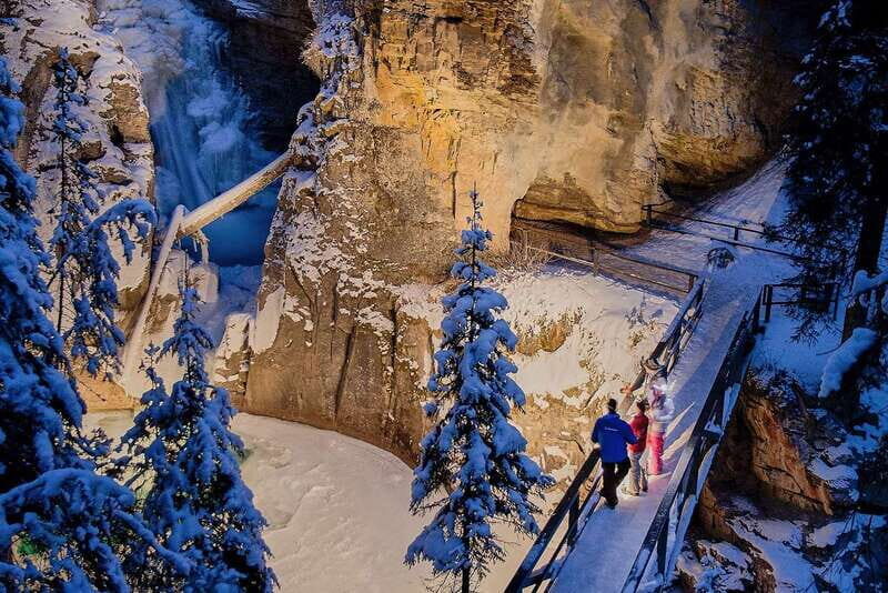 Banff: Johnston Canyon Evening Icewalk - Ice cleats, poles, and the winter safety moment that matters